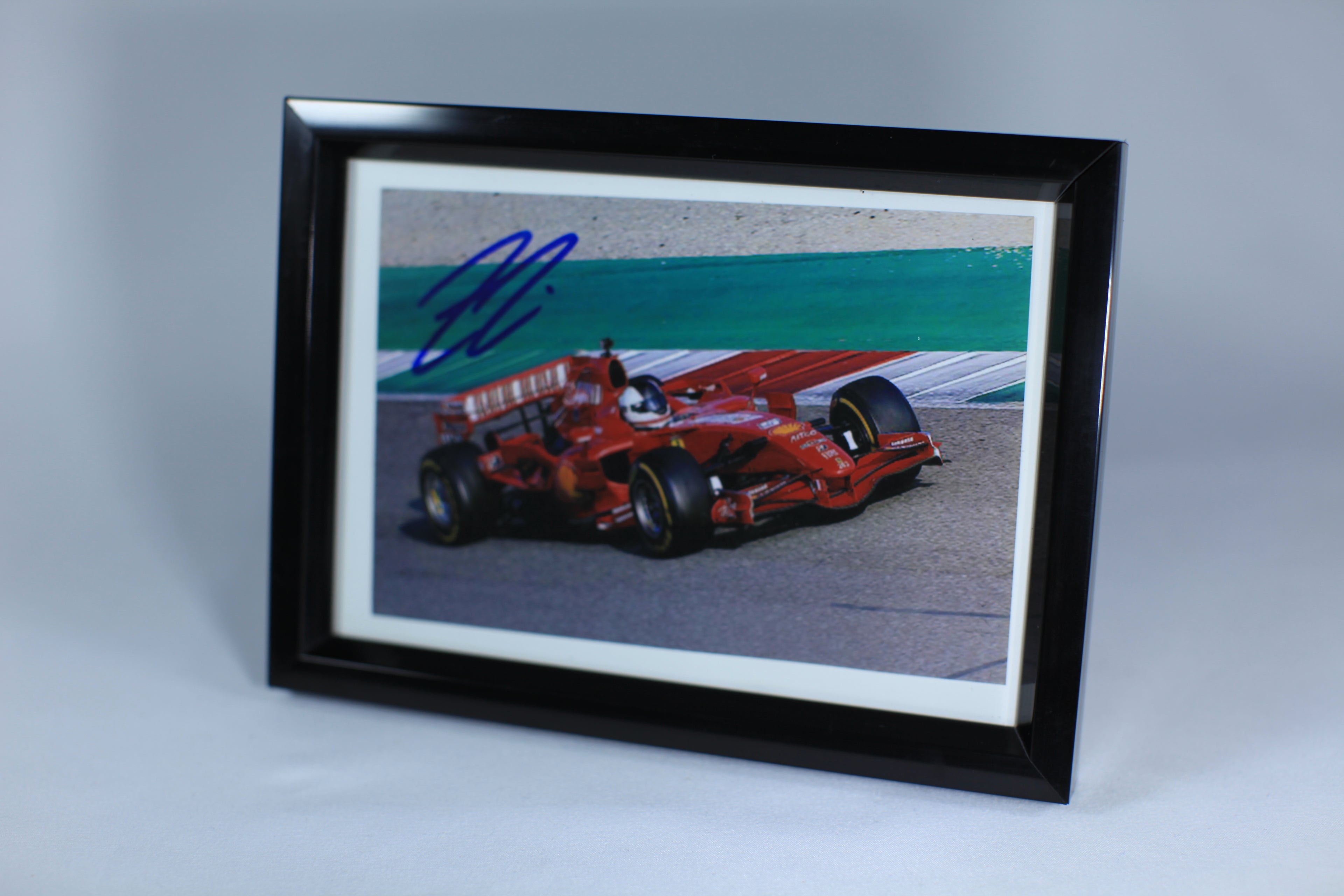 Photograph by Kimi Räikkönen Scuderia Ferrari Formula 1